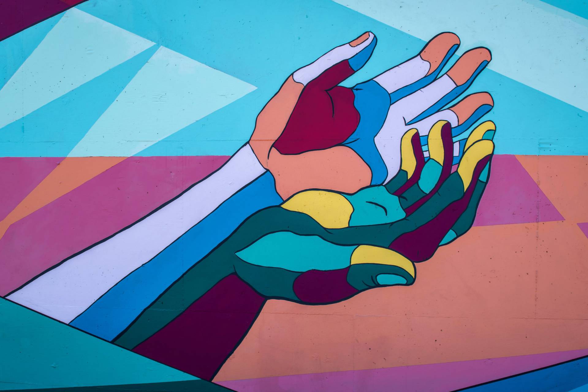 painted hands reaching out